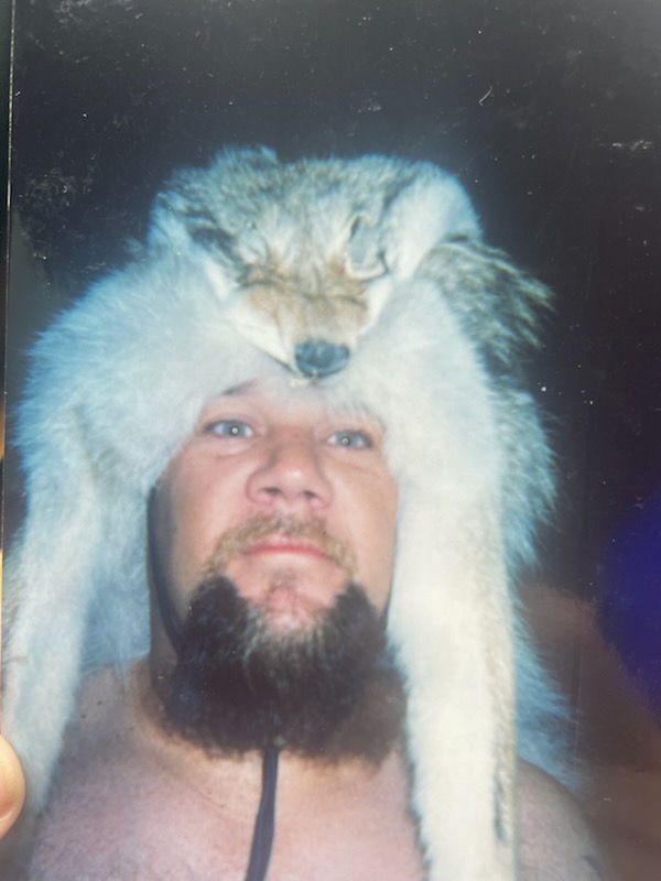 An archival portrait of Marcus wearing a fur hat
