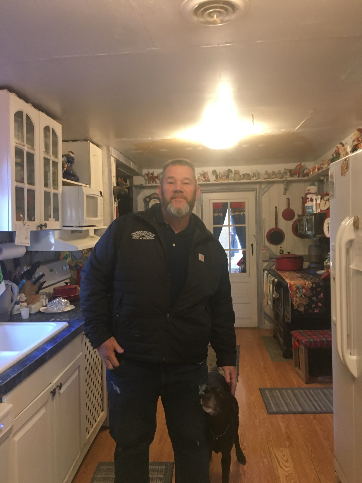 Marcus Waters at home with his dog