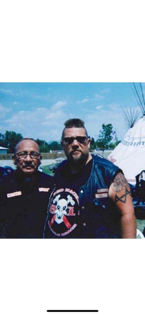 Marcus with a friend at an outdoor gathering